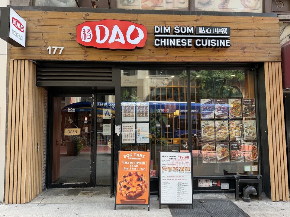 Chinese dishes served in a busy dining room.